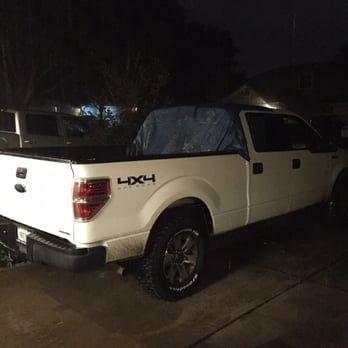 Daisy Motor Group - This is a picture of my truck covered with a tarp because of the water leak that Daisy wouldn't repair and didn't tell me about. - Car Dealers Near Me - Round Rock, Texas