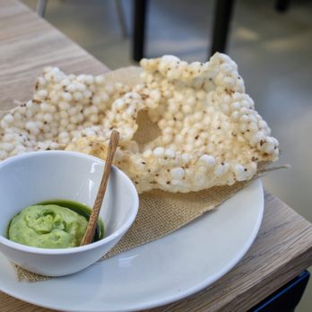 De Kas - Tapioca cracker with celery, egg white, olive oil dip - Modern European Near Me - Amsterdam, New Hampshire