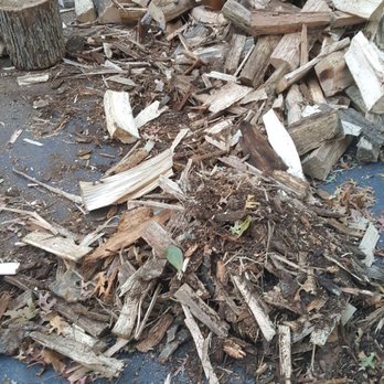 Enos Landscape Supplies - a pile of wood in front of a house - Landscaping Near Me - Bridgewater, Massachusetts Enos Landscape Supplies - a pile of wood in front of a house - Landscaping Near Me - Bridgewater, Massachusetts