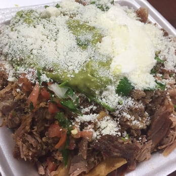 El Toro Bravo - Carnitas Nachos. Pretty bomb. I would ask for additional hot sauce for that zing. - Mexican Near Me - Tustin, California
