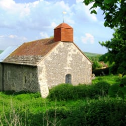 Coombes Church - The little church nestles in its hillside.
