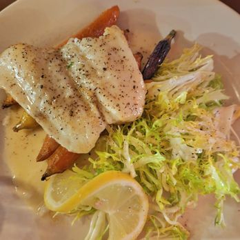 The Drunken Horse - Pan Seared Seabass with beurre blanc sauce, frisee greens, tricolor carrots and cipollini onions. Light fish flavor. Highly recommend! - Wine Bars Near Me - St. Augustine, Florida
