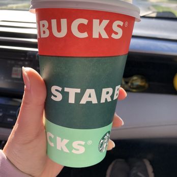 Starbucks - a person holding a starbucks cup in their hand - Coffee & Tea Near Me - Akron, Ohio