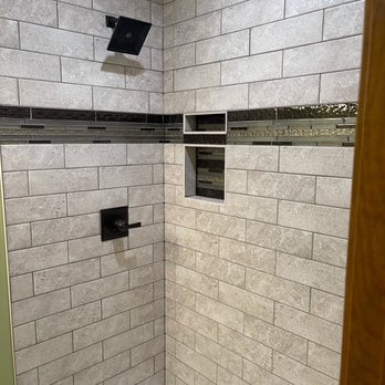Alpha Tile - a bathroom with a shower and a toilet - Tiling Near Me - Overland Park, Kansas