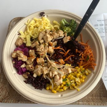 BIBIBOP Asian Grill - Purple rice, corn, carrots, red cabbage, bean sprouts, chicken, eggs. The sauce is fire - gochujang - Asian Fusion Near Me - Westlake, Ohio