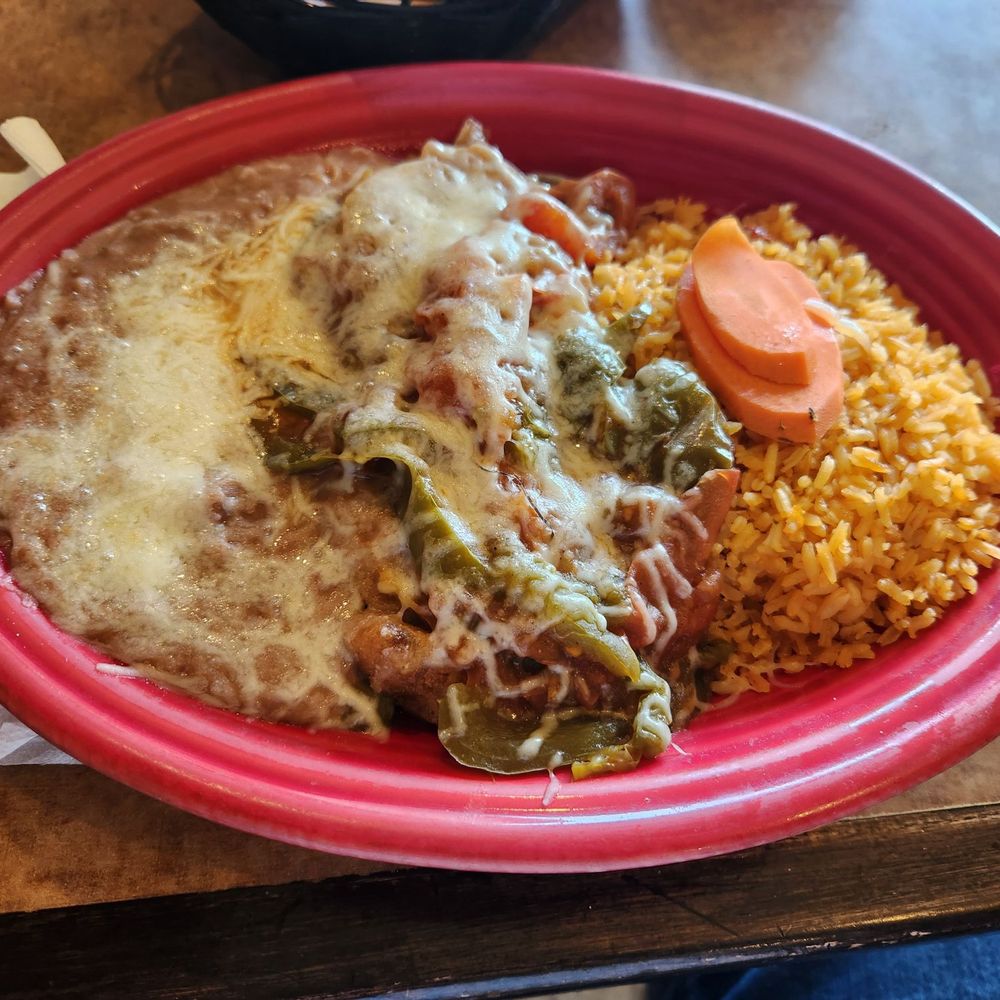 The wire is on the chile relleno you can see it on the cheese. The wire is on the chile relleno you can see it on the cheese.