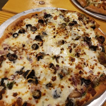 Pizza by Design 2 - two pizzas on a table - Pizza Near Me - Abilene, Texas Pizza by Design 2 - two pizzas on a table - Pizza Near Me - Abilene, Texas