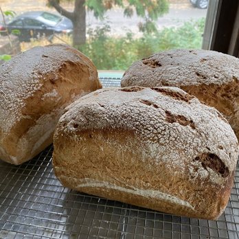 Atuvava Bakery - three loafs of bread on a cooling rack - Bakeries Near Me - Minneapolis, Minnesota Atuvava Bakery - three loafs of bread on a cooling rack - Bakeries Near Me - Minneapolis, Minnesota