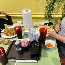 Pho Gia - Kids eating lo mein and shrimp and rice plate.