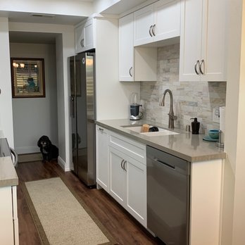 Elite Remodeling & Design - New kitchen, moved the fridge over to the water line and added beautiful white shaker cabinets. - General Contractors Near Me - San Diego, California