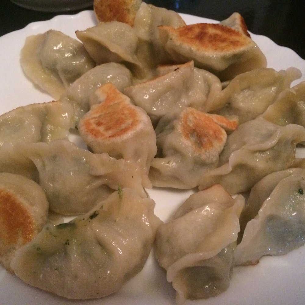 Wok Show - Pork & spinach filled fried dumplings. - Chinese Near Me - Berlin, BE Wok Show - Pork & spinach filled fried dumplings. - Chinese Near Me - Berlin, BE