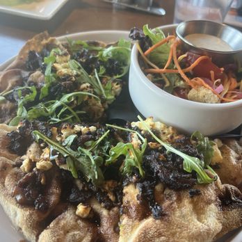 Bucket List Tavern - Bourbon Bacon pizza with feta and arugula. Side house salad in the bowl. - Burgers Near Me - Castle Rock, Colorado Bucket List Tavern - Bourbon Bacon pizza with feta and arugula. Side house salad in the bowl. - Burgers Near Me - Castle Rock, Colorado