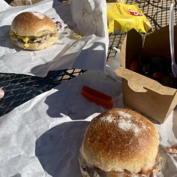 Bock Burger Takeaway - Two single cheeseburgers- one with salad and one with chips. Delicious! - Burgers Near Me - Alpine, Texas Bock Burger Takeaway - Two single cheeseburgers- one with salad and one with chips. Delicious! - Burgers Near Me - Alpine, Texas