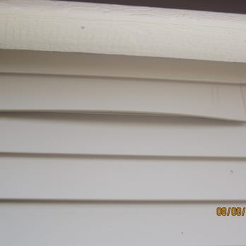 Garage For You - Siding buckling on the side of the garage. - Garage Door Services Near Me - Mount Prospect, Illinois Garage For You - Siding buckling on the side of the garage. - Garage Door Services Near Me - Mount Prospect, Illinois