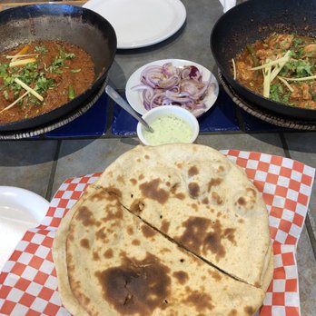 Karahi Point - Tandoori roti, Mint Raita, Seekh Kebab Karahi (left), Boneless Chicken Peshawari Karahi (right) - Indian Near Me - Etobicoke, Ontario