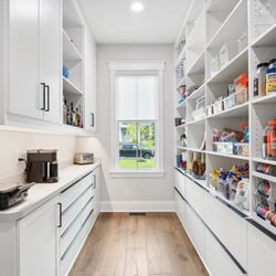 Closet Factory - Pantry with counter space for extra appliances, open and concealed shelves, and drawers.