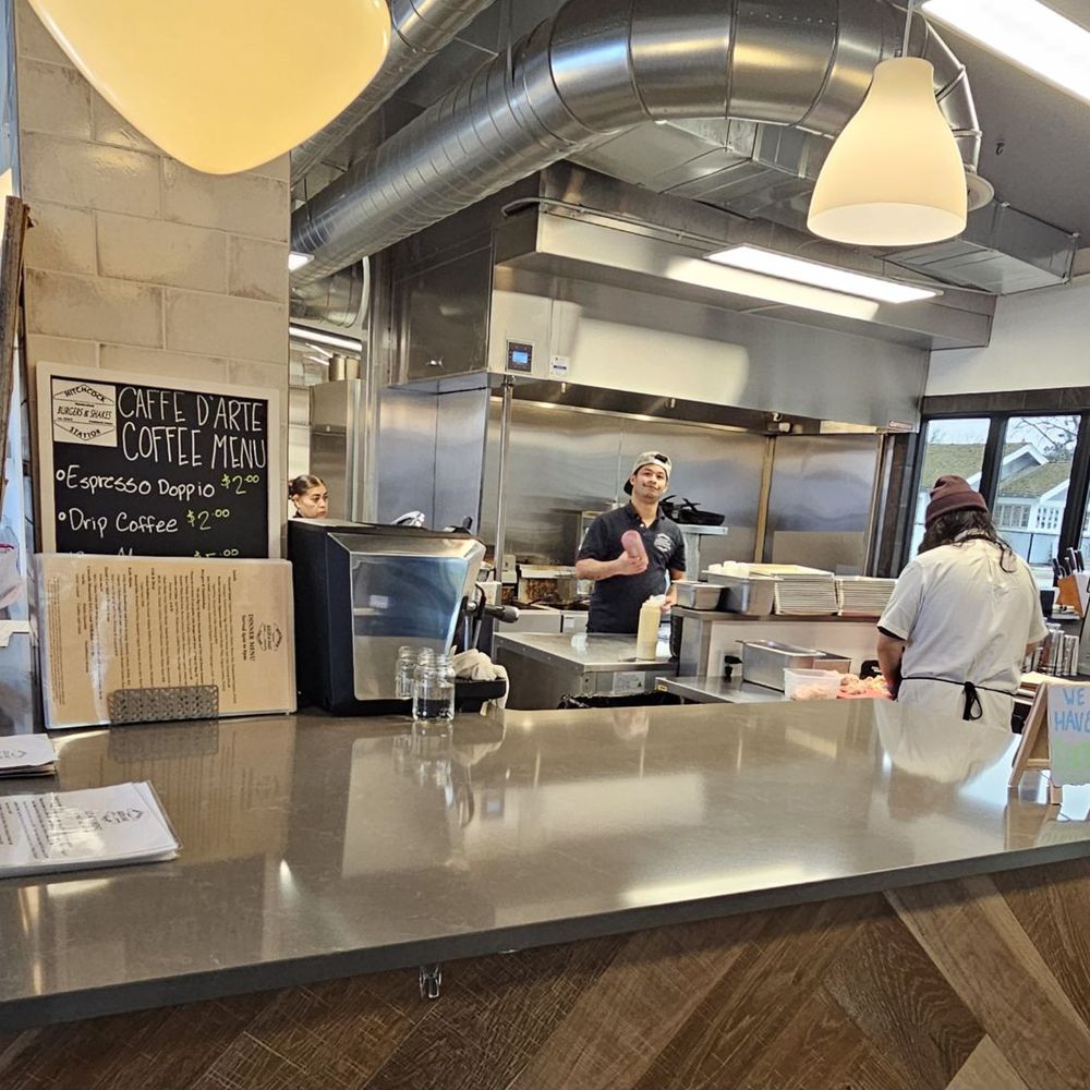 Hitchcock Station - Open kitchen. Owner Emran Chowdbury is pictured in center. - Salad Near Me - Fruitland, Idaho