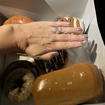 Voodoo Doughnut - My hand next Maple Bar for size reference - Donuts Near Me - Houston, Texas