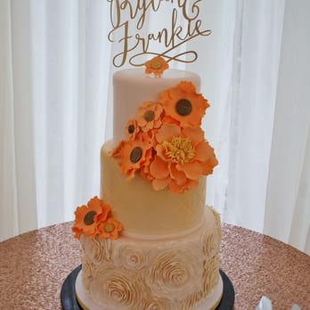 A Sweet Affair - a wedding cake with orange flowers - Bakeries Near Me - Fort Bragg, California