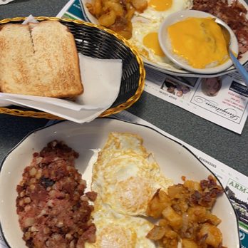 Tip Top Restaurant - 2 eggs Two Eggs, Any Style With Corned Beef Hash and cheese grits - Diners Near Me - Charlottesville, Virginia Tip Top Restaurant - 2 eggs Two Eggs, Any Style With Corned Beef Hash and cheese grits - Diners Near Me - Charlottesville, Virginia