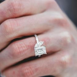 Hingham Jewelers - Platinum engagement ring custom designed at Hingham Jewelers using an emerald cut and marquise diamond.
