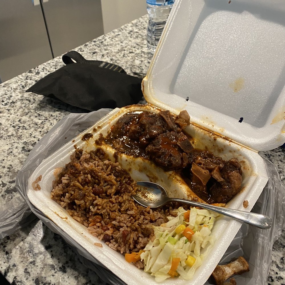 Dumplin Restaurant - an open takeout container of food - Caribbean Near Me - West Palm Beach, Florida