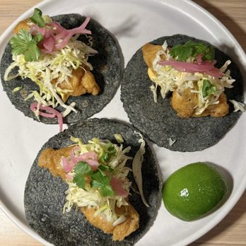 Mala Pata Molino + Cocina - Relleno-Battered NC Catch of the Day on fresh Blue Corn Tortillas topped with Sofrito Aioli, Mango Curtido, and Pickled Onions - Mexican Near Me - Raleigh, North Carolina Mala Pata Molino + Cocina - Relleno-Battered NC Catch of the Day on fresh Blue Corn Tortillas topped with Sofrito Aioli, Mango Curtido, and Pickled Onions - Mexican Near Me - Raleigh, North Carolina