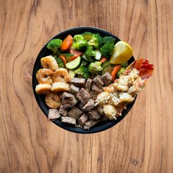 Soy Hibachi - Trio, Choice of 3 Proteins
(Shrimp, Lobster, and Top Sirloin Steak Pictured )