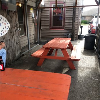Friday's South - a man sitting at a picnic table - Dive Bars Near Me - Belleville, Illinois Friday's South - a man sitting at a picnic table - Dive Bars Near Me - Belleville, Illinois