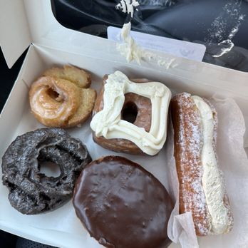 Golden Hands Bakery - Old fashion, choc. old fashioned, long John w/ cream, cinnamon square with cream cheese frosting and custard filled with chocolate glaze - Donuts Near Me - Cincinnati, Ohio