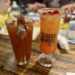 Hash House A Go Go - "Bloody Mark" (Maker's mark, bacon salt rim w/ a candied bacon slice and lemon) and "New Amsterdam Vodka Sunrise"