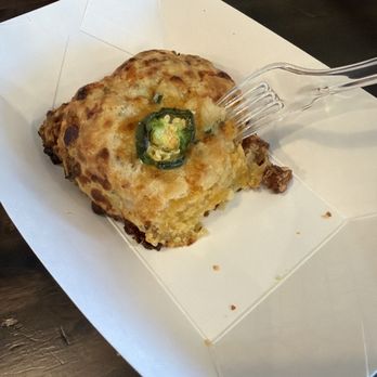 Country Charm Coffee - Sausage Jalapeño Scone one bite in. - Coffee & Tea Near Me - Anna, Texas