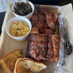 Ribs, sausage, Mac n cheese, and greens. Ribs, sausage, Mac n cheese, and greens.