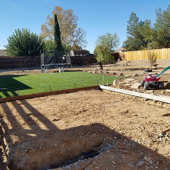 Woosley Construction - New Sod in the background after Dennis and crew took out about 30 yards of material. The foreground is prep work for RV parking, and pad. - Masonry/Concrete Near Me