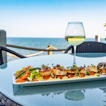Bluefin Grille - a plate of food and a glass of wine - New American Near Me - Tofte, Minnesota Bluefin Grille - a plate of food and a glass of wine - New American Near Me - Tofte, Minnesota