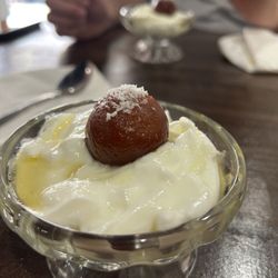 Mitho Nepali - Gulab Jamun w/yogurt: deep fried milk solids soaked in a sweet sauce with yogurt.