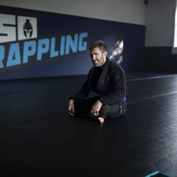 150 Grappling member waiting to train BJJ on the training mats.
