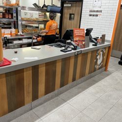 Popeyes Louisiana Kitchen - Dirty counter and confused attendant.
