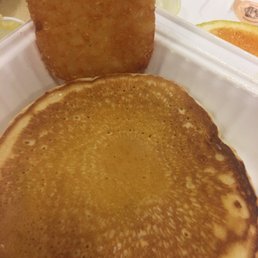 Chocolate chip pancakes and a hashbrown Chocolate chip pancakes and a hashbrown
