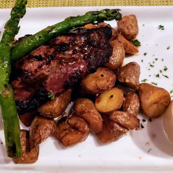 Bistro Joe's - Center cut strip steak, fingerling potatoes, asparagus, and zip sauce on side - New American Near Me - Birmingham, Michigan