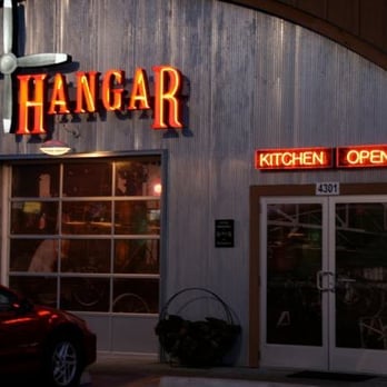 The Hangar - a red car parked in front of the hangar - New American Near Me - Kalamazoo, Michigan