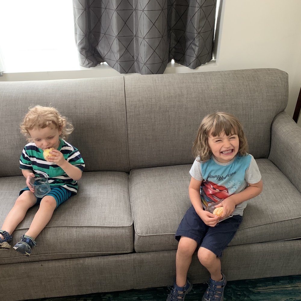 Hotel Indigo Baltimore Downtown - Kids loving the couch living area with some complimentary oranges! - Hotels Near Me - Baltimore, Maryland Hotel Indigo Baltimore Downtown - Kids loving the couch living area with some complimentary oranges! - Hotels Near Me - Baltimore, Maryland
