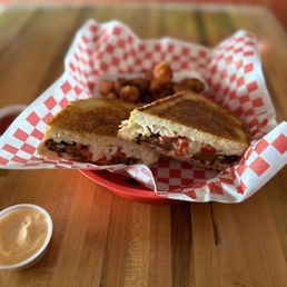 Veggie Burger Melt w/ sweet potato tater tots.