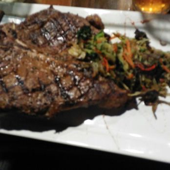 Stonebridge Grille - Porterhouse steak with red potatoes and brussel proud slaw. - New American Near Me - Parkton, Maryland Stonebridge Grille - Porterhouse steak with red potatoes and brussel proud slaw. - New American Near Me - Parkton, Maryland