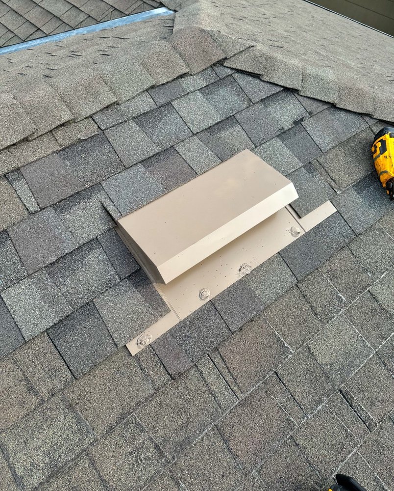 Slide of Maginis Roofing