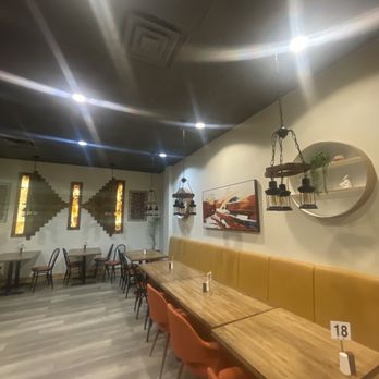 Anatolian Kitchen - a long table with orange chairs - Turkish Near Me - Bethlehem, Pennsylvania