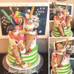Main Street Baker - This was one of the cakes he did on the same day for a birthday. This cake is on his page. Mine isn't. Wonder why?????