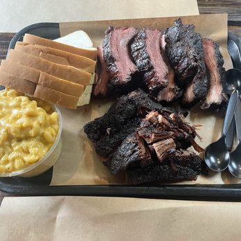 Two Bros BBQ Market - This is a pound and a half of pork ribs and a pound of brisket with a medium size mac & cheese - Barbeque Near Me - San Antonio, Texas Two Bros BBQ Market - This is a pound and a half of pork ribs and a pound of brisket with a medium size mac & cheese - Barbeque Near Me - San Antonio, Texas
