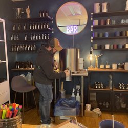 Cord + Iron - One of the owners pouring some fresh wax for our candles!