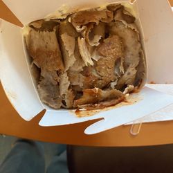 König Kebap - Lamb with sauces, yogurt, and fries.